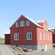 A charming pitched roof structure featuring numerous windows